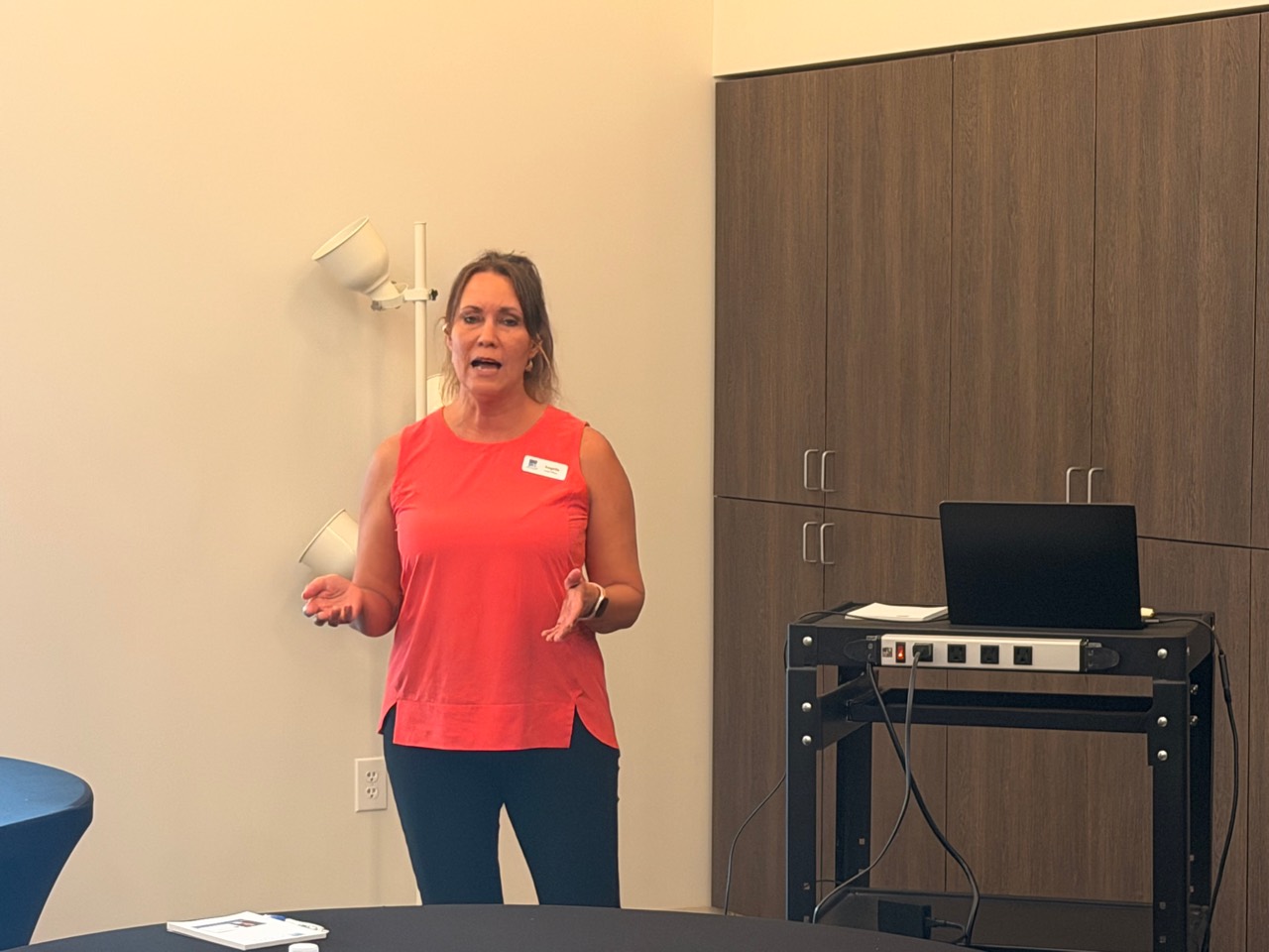 Presenter speaking at a previous TREW Community Forum.